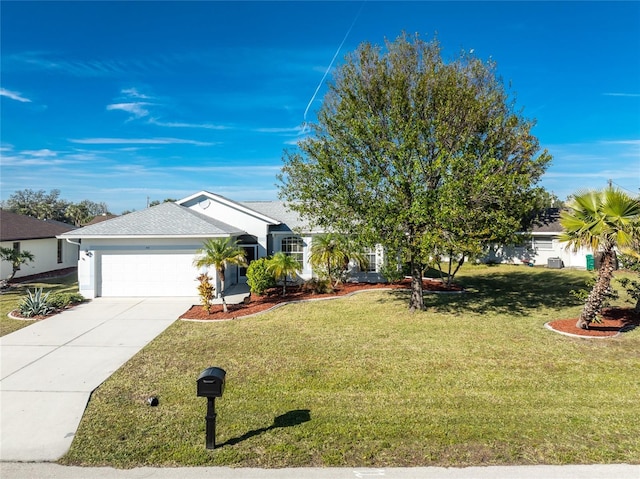 view of front of home featuring a garage and a front lawn