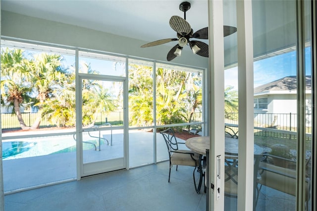 sunroom with ceiling fan and a wealth of natural light