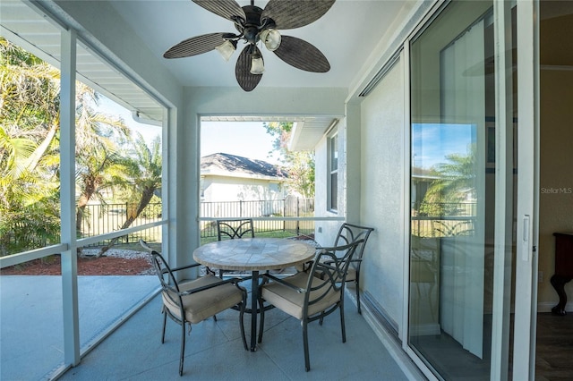 sunroom / solarium with ceiling fan