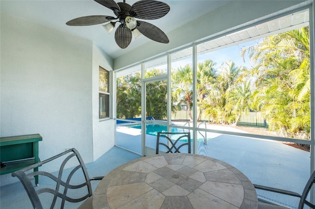 sunroom / solarium with ceiling fan