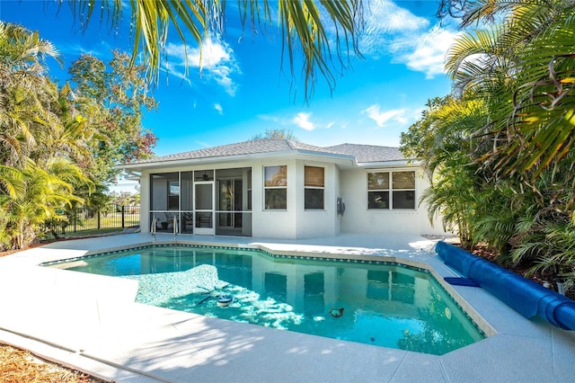 view of pool with a sunroom