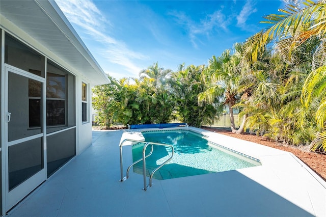 view of swimming pool featuring a patio area