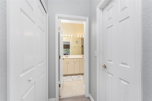 hallway with light tile patterned flooring