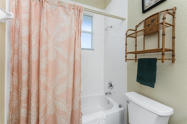 bathroom featuring toilet and shower / bath combo