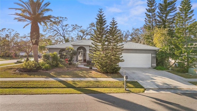 obstructed view of property with a garage