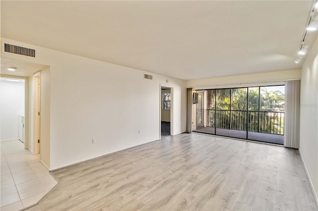 empty room featuring light hardwood / wood-style floors