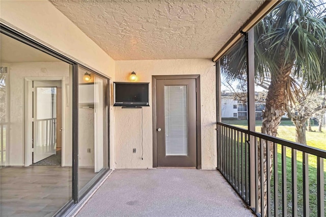 property entrance with a balcony