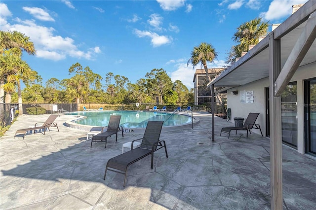 view of swimming pool featuring a patio area