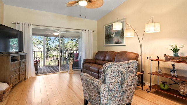 living room featuring light hardwood / wood-style flooring and ceiling fan