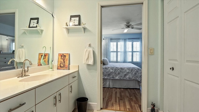 bathroom with vanity, wood-type flooring, and ceiling fan