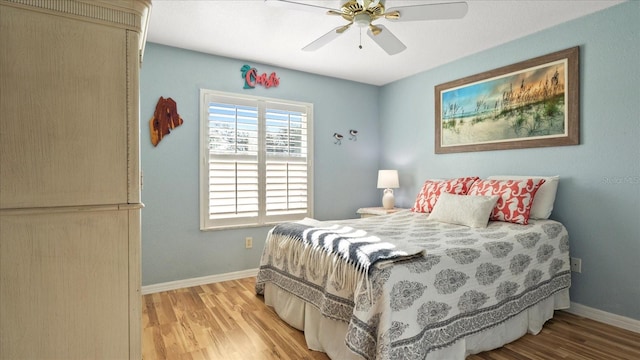 bedroom with ceiling fan and light wood-type flooring