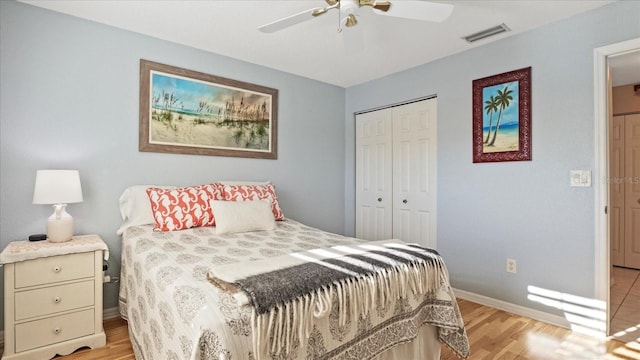 bedroom featuring light hardwood / wood-style floors, a closet, and ceiling fan