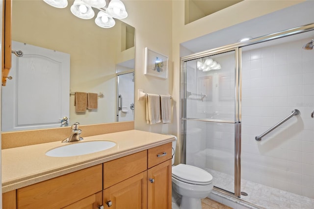 bathroom featuring vanity, toilet, and walk in shower