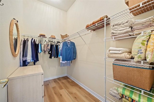 walk in closet featuring light hardwood / wood-style floors