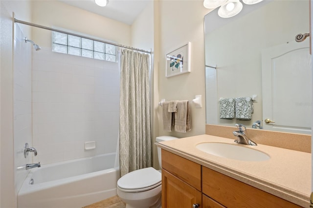 full bathroom with vanity, toilet, and shower / tub combo with curtain