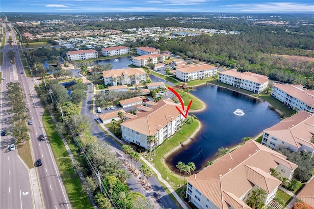 birds eye view of property featuring a water view