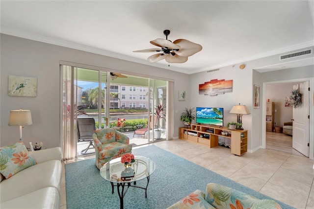 living room featuring crown molding, light tile patterned floors, and ceiling fan