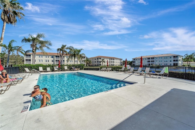 view of swimming pool with a patio