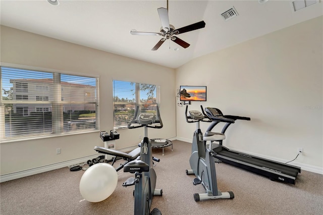 exercise area featuring vaulted ceiling and ceiling fan