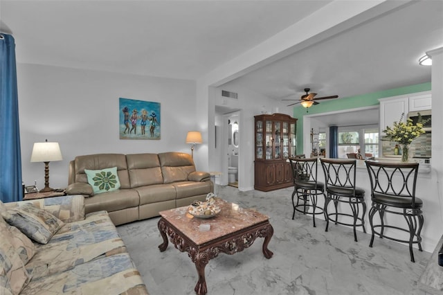 living room featuring ceiling fan