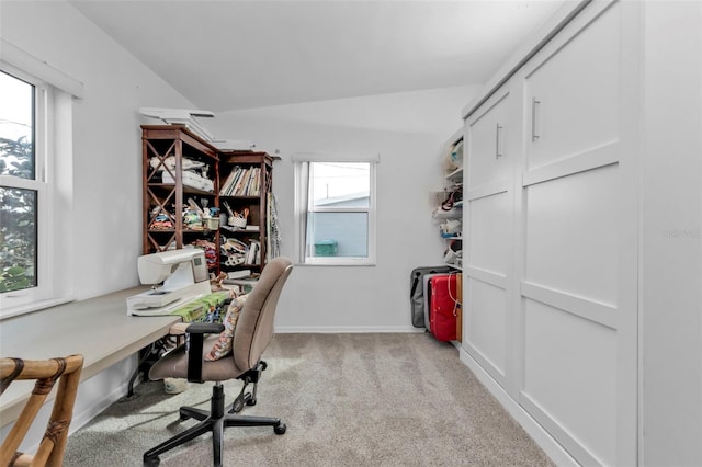 carpeted office space with lofted ceiling