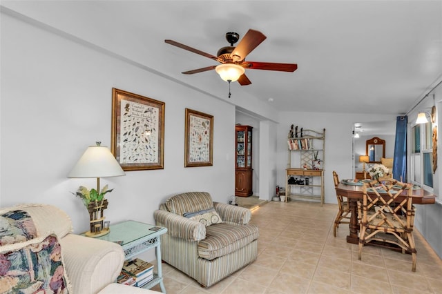 tiled living room with ceiling fan