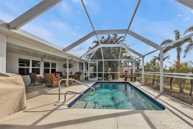 view of pool featuring a lanai, an outdoor hangout area, and a patio area