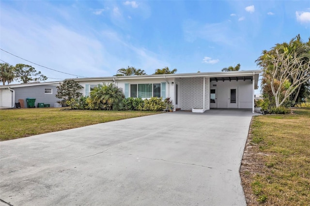 ranch-style home featuring a carport and a front yard