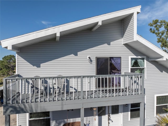 back of property with a balcony