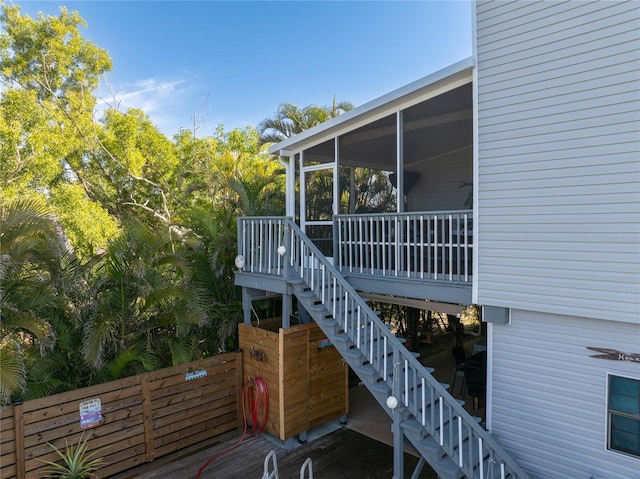 view of property exterior featuring a sunroom