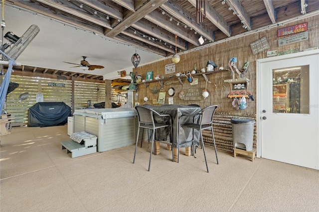 view of patio with a hot tub and ceiling fan