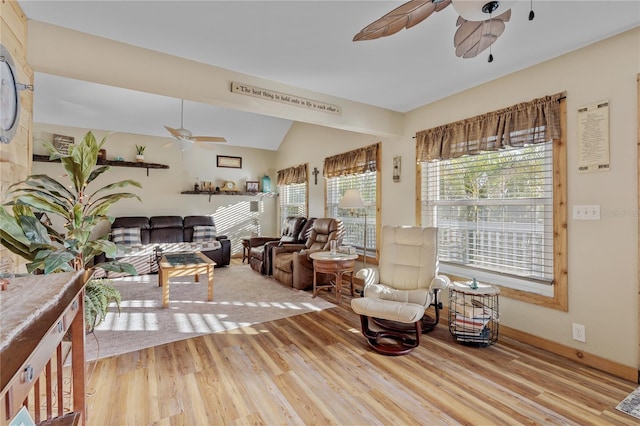 sitting room with ceiling fan, lofted ceiling, and light hardwood / wood-style flooring