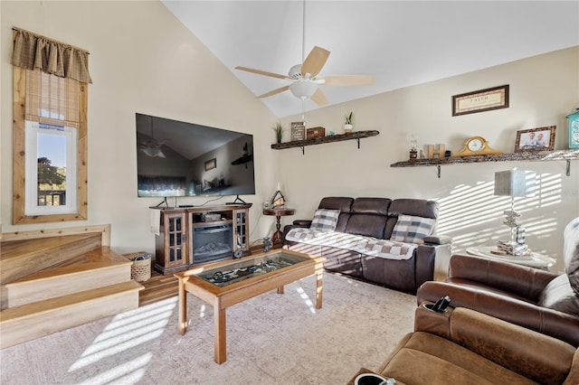 living room featuring high vaulted ceiling and ceiling fan