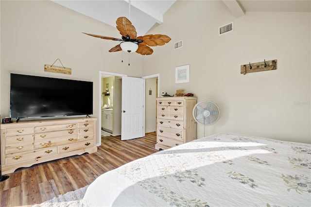 bedroom featuring ensuite bathroom, high vaulted ceiling, light hardwood / wood-style flooring, beamed ceiling, and ceiling fan