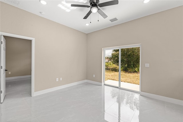 unfurnished room with marble finish floor, visible vents, and baseboards