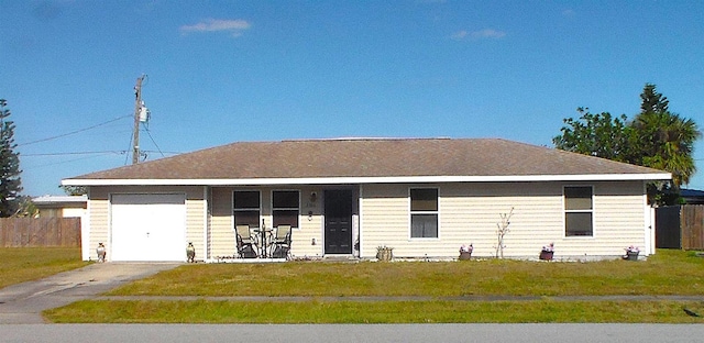 3380 Maple Ter, Port Charlotte, FL 33952 - single story home featuring a front yard, driveway, fence, and an attached garage