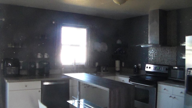 kitchen with white cabinetry, wall chimney range hood, dishwasher, and stainless steel electric range oven