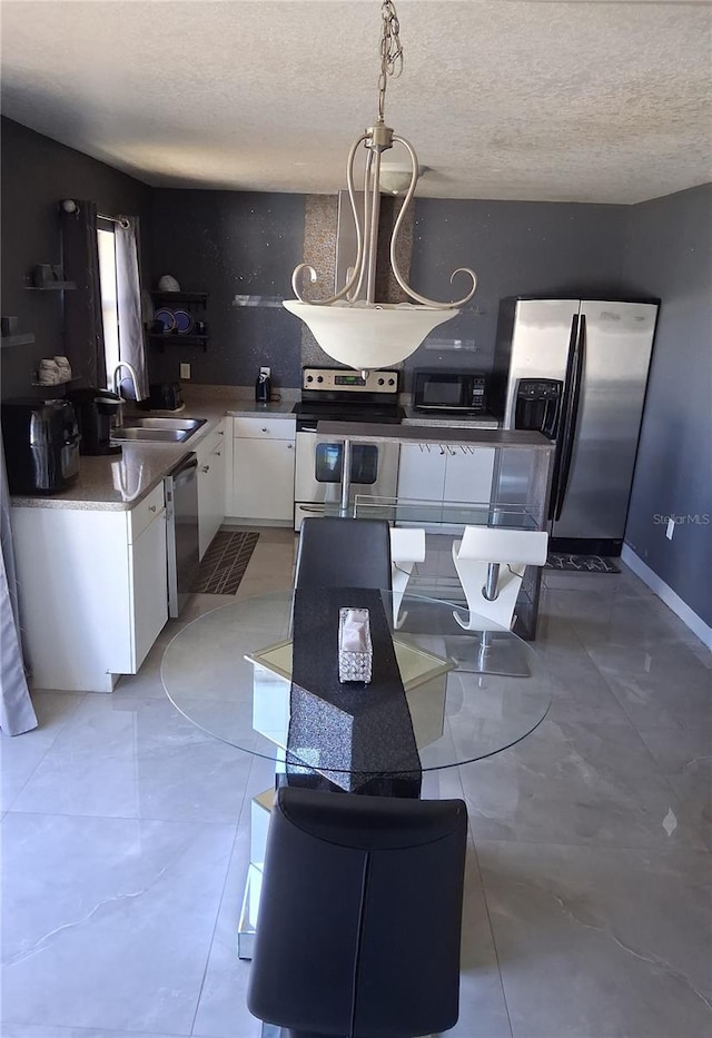 3380 Maple Ter, Port Charlotte, FL 33952 - dining room with a textured ceiling