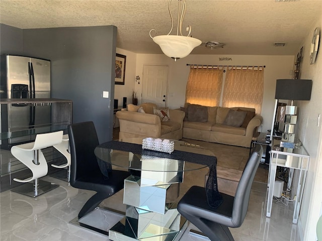 3380 Maple Ter, Port Charlotte, FL 33952 - dining space featuring a textured ceiling