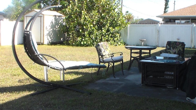 3380 Maple Ter, Port Charlotte, FL 33952 - view of patio featuring an outdoor structure, a fenced backyard, and a storage shed