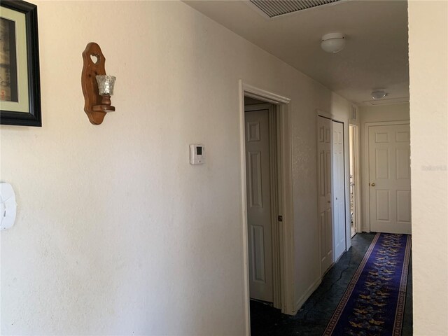 3380 Maple Ter, Port Charlotte, FL 33952 - hallway with baseboards and visible vents