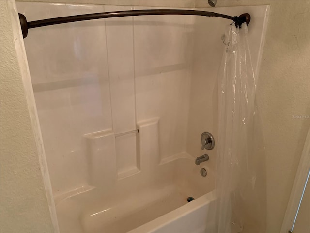 3380 Maple Ter, Port Charlotte, FL 33952 - full bath with shower / bath combo and a textured wall