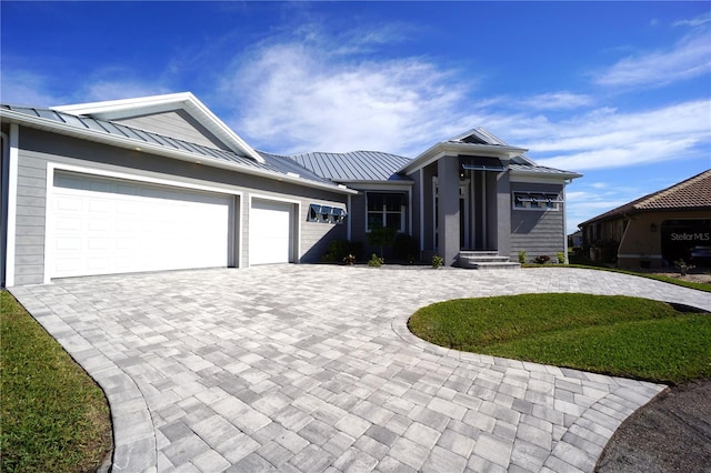 view of front of home with a garage