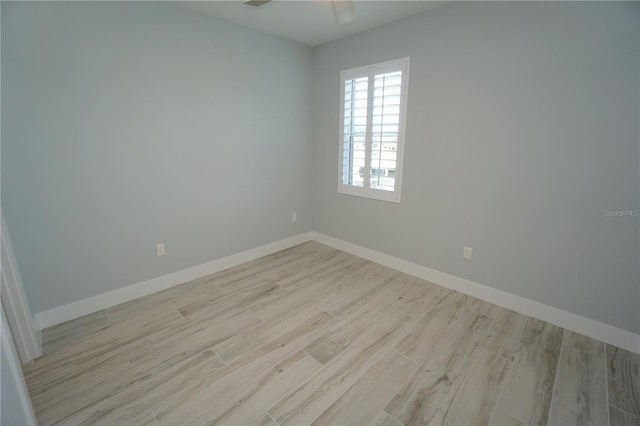 unfurnished room featuring ceiling fan and light hardwood / wood-style floors