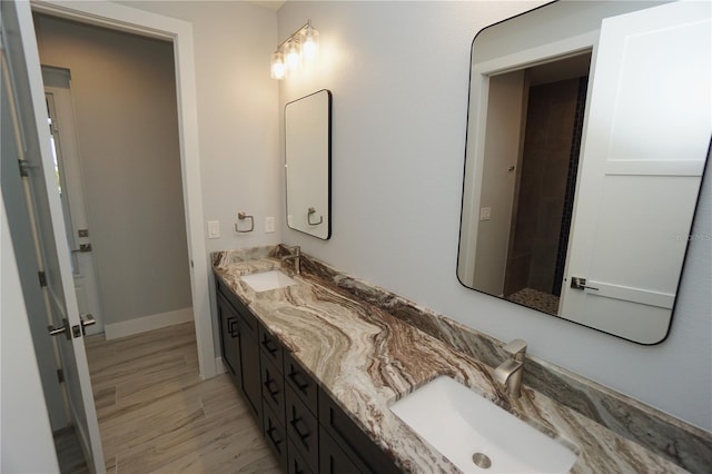 bathroom featuring vanity and hardwood / wood-style floors