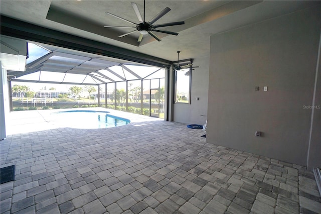 view of swimming pool featuring ceiling fan