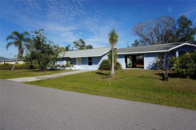 single story home featuring a front lawn