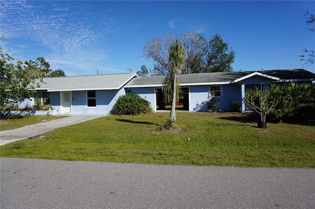 single story home with a front yard