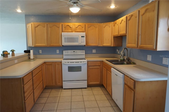 kitchen with light tile patterned flooring, white appliances, ceiling fan, and sink