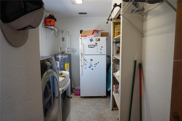 clothes washing area featuring washer / clothes dryer and water heater